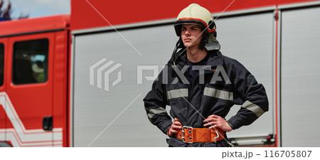 Professional Firefighter Suits Up in Full Gear for Duty Professional Firefighter Suits Up in Full Gear for Duty 116705807