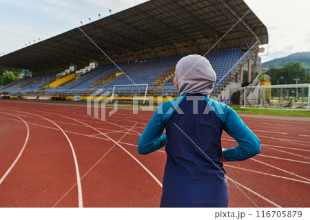 A muslim woman in a burqa sports muslim clothes running on a marathon course and preparing for upcoming competitions A muslim woman in a burqa sports muslim clothes running on a marathon course and preparing for upcoming competitions 116705879