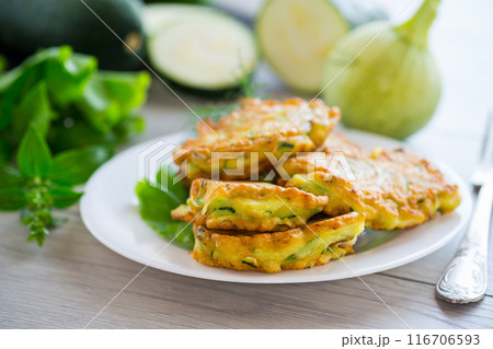 homemade food, fried zucchini pancakes 116706593