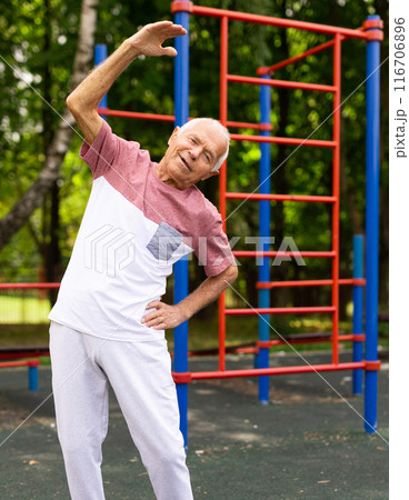 Elderly man exercising and leading a healthy lifestyle in retirement Elderly man exercising and leading a healthy lifestyle in retirement 116706896