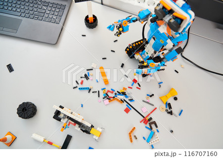 Various components and installations for robot fabrication fill the space, representing the intricate blend of technology, engineering, and innovation involved in the development and assembly of 116707160