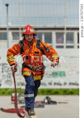 Firefighter Training and Preparing in Professional Gear for Job Hazards Firefighter Training and Preparing in Professional Gear for Job Hazards 116707583
