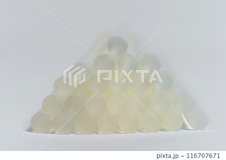 hot glue sticks on a white background. rods for pistol sizing of objects hot glue sticks on a white background. rods for pistol sizing of objects 116707671