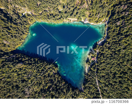 Drone shot flying. Lago Inferiore di Fusine Lake in Italy. Boat. Drone shot flying. Lago Inferiore di Fusine Lake in Italy. Boat. 116708366