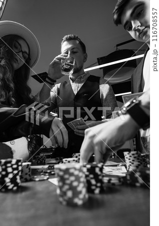 A team of young boys and girls play poker. First-person observation of card poker from various close-up angles. A team of young boys and girls play poker. First-person observation of card poker from various close-up angles. 116708557