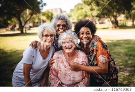 In this heartwarming photograph, a group of elderly individuals revels in the serenity of nature, enjoying leisurely moments in the outdoors, embracing the camaraderie and contentment that retirement 116709368