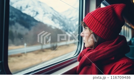 With a serene smile, she enjoys the blissful moments of being alone, accompanied only by the winter scenery With a serene smile, she enjoys the blissful moments of being alone, accompanied only by the winter scenery 116709486