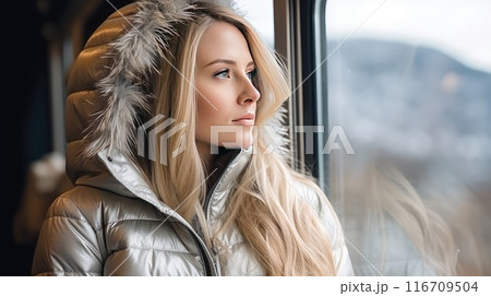 Mesmerized by the snowy panorama, a woman's smile radiates a sense of blissful solitude, embracing the magic of solo travel amidst the winter scenery Mesmerized by the snowy panorama, a woman's smile radiates a sense of blissful solitude, embracing the magic of solo travel amidst the winter scenery 116709504