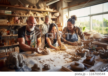 A diverse group of people come together to learn the art of pottery-making in a workshop, receiving instruction and guidance on sculpting clay into various vessels and forms.Generated image 116709544