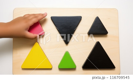 Delicate hands feel the warmth of kinetic sand, engaging in a soothing tactile experience 116709545