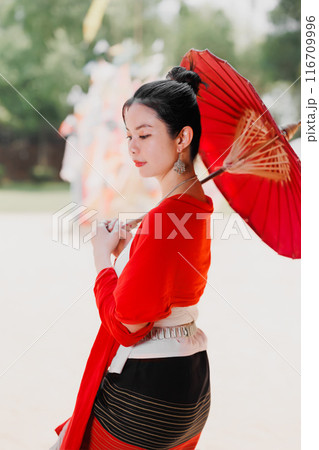 Northern Thai Chiangmai lanna people in traditional style clothes beautiful women old vintage dressing with paper umbrella at wat ton kwen. 116709996