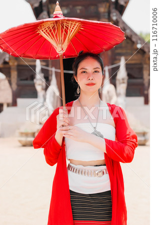 Northern Thai Chiangmai lanna people in traditional style clothes beautiful women old vintage dressing with paper umbrella at wat ton kwen. Northern Thai Chiangmai lanna people in traditional style clothes beautiful women old vintage dressing with paper umbrella at wat ton kwen. 116710006