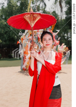 Northern Thai Chiangmai lanna people in traditional style clothes beautiful women old vintage dressing with paper umbrella at wat ton kwen. Northern Thai Chiangmai lanna people in traditional style clothes beautiful women old vintage dressing with paper umbrella at wat ton kwen. 116710009