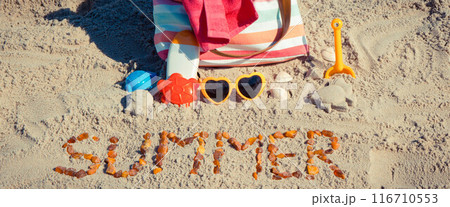 Inscription summer, accessories for relax or sunbathing and children toys for playing on beach Inscription summer, accessories for relax or sunbathing and children toys for playing on beach 116710553