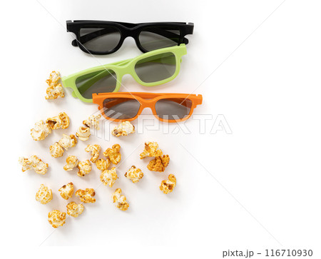 caramel popcorn and 3D glasses on white background 116710930