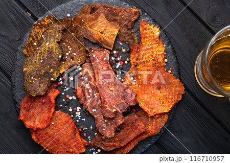 Mix of dried meat Jerky . From chicken , beef and pork. 116710957