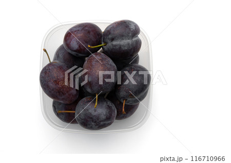 ripe plums in box isolated on white background ripe plums in box isolated on white background 116710966