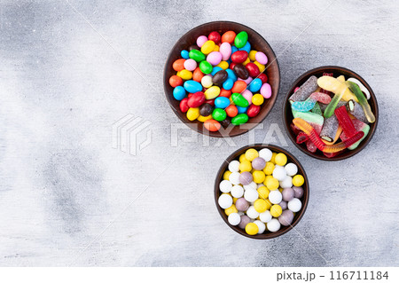 Mix of colorful candies . Multicolored unhealthy background. Sweet dessert 116711184