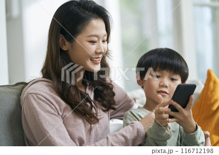 young asian mother keeping company with son young asian mother keeping company with son 116712198