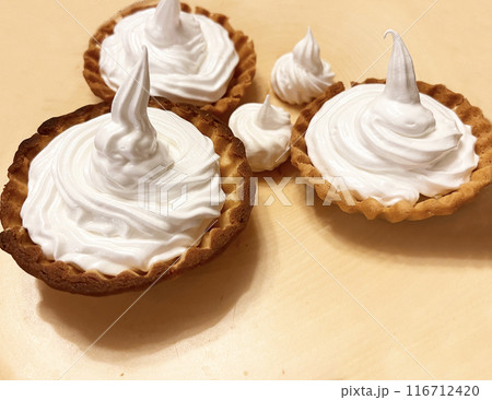 Freshly baked baskets with curd cream and strawberries	 116712420