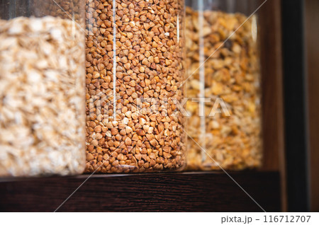 Kitchen pantry, jars and containers with food, food storage. Jars of cereals, kitchen utensils 116712707
