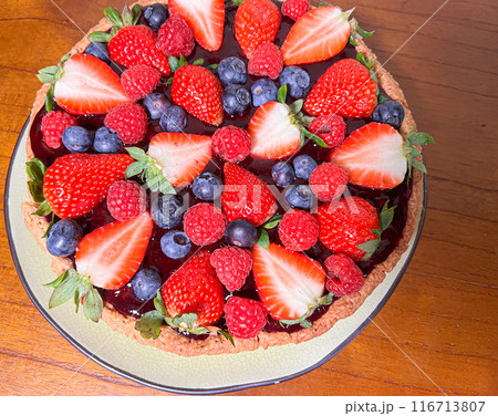 Freshly baked baskets with curd cream and strawberries	 116713807