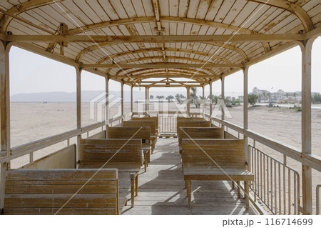 Interior of Abandoned Wooden Train Carriage in Desert 116714699
