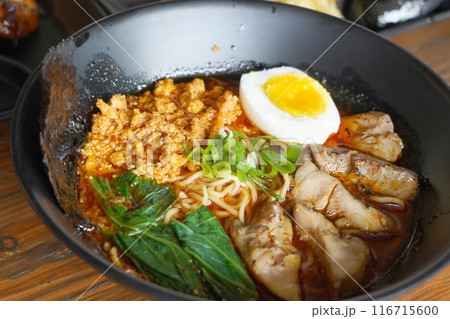 bowl of ramen noodles with a rich broth bowl of ramen noodles with a rich broth 116715600