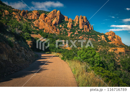 Winding road and red rocks in the Esterel massif, France 116716789