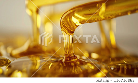 Golden oil flowing in a stream. 116716865