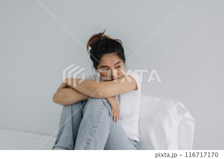 Sad and depressed woman stay alone in the room. Sad and depressed woman stay alone in the room. 116717170