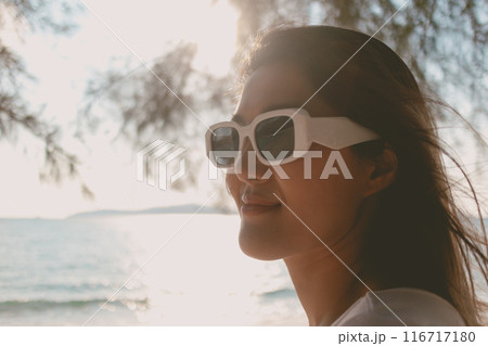 Close up portrait of cheerful woman enjoy the beach vibe. Close up portrait of cheerful woman enjoy the beach vibe. 116717180
