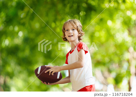 Family playing American football. Kids play rugby 116718204