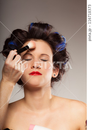 Makeup artist applying powder Makeup artist applying powder 116718373