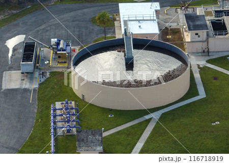Aerial view of modern water cleaning facility at urban wastewater treatment plant. Purification process of removing undesirable chemicals, suspended solids and gases from contaminated liquid 116718919