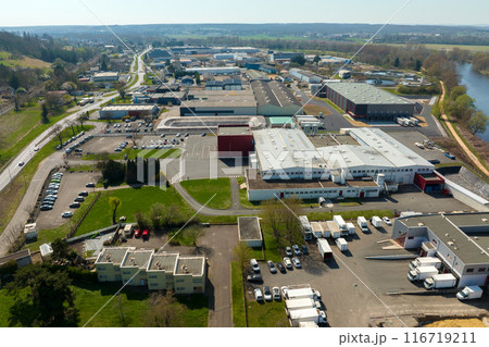 Aerial view of goods warehouses and logistics center in industrial city zone from above 116719211