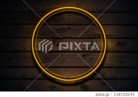Orange neon luminous circle frame on dark brown wooden abstract background Orange neon luminous circle frame on dark brown wooden abstract background 116720245