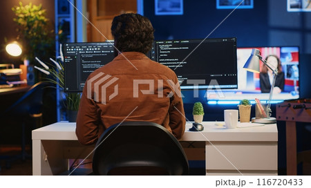 Engineer arriving in home office with mug of coffee in hand, ready to start coding using javascript. IT expert beginning remote work shift, holding cup of tea, updating company software, camera A 116720433