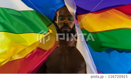 African American gay man with bright makeup and African American gay man with bright makeup and 116720925