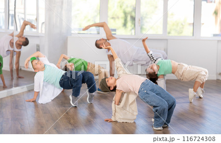 Group of children dancers having break dance training at dance studio Group of children dancers having break dance training at dance studio 116724308