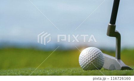 Golf clubs and balls on a green lawn in a beautiful golf course with morning sunshine. Golf clubs and balls on a green lawn in a beautiful golf course with morning sunshine. 116726160