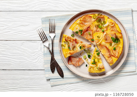 deli ham onion omelette on skillet, top view deli ham onion omelette on skillet, top view 116728050