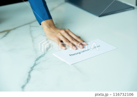 A woman handing resignation letter. A woman handing resignation letter. 116732106