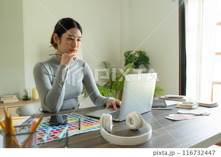 Young female architect envisions project with technology. Young female architect envisions project with technology. 116732447