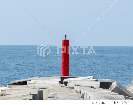 Red lighthouse on the pier at the port entrance. 116735765