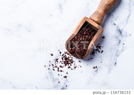 Dried spice sumac - popular ingredient in Middle Eastern cuisine. Dried spice sumac - popular ingredient in Middle Eastern cuisine. 116736133