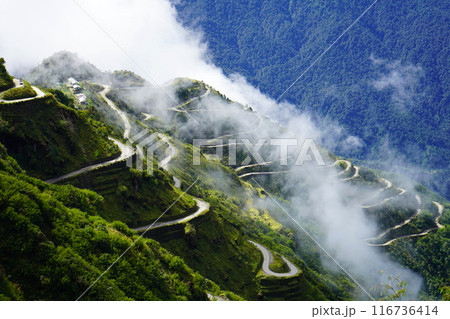 Old Silk Route Zig Zag Road Background with white Cloud Old Silk Route Zig Zag Road Background with white Cloud 116736414
