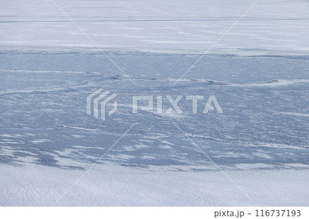 an ice-covered river in winter 116737193