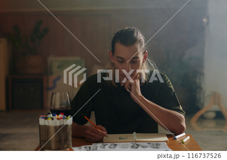 Designer Working At His Worklace Designer Working At His Worklace 116737526
