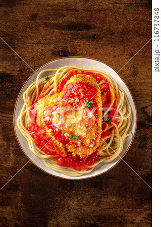 Chicken Parmesan, Italian pasta dish. Breaded chicken breast with cheese Chicken Parmesan, Italian pasta dish. Breaded chicken breast with cheese 116737848